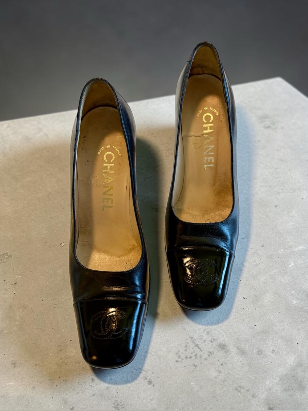 CHANEL Black Patent Leather Square-Toe Pumps with Embossed CC